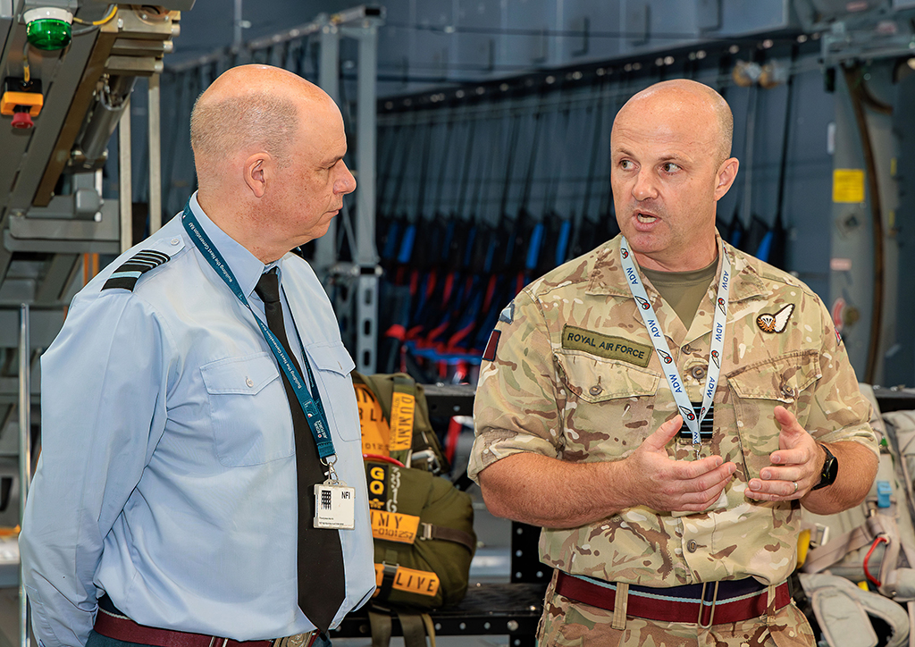 The Deputy Chief of the Air Staff, Air Marshal Paul Lloyd CBE MSc MA MDA BEng CEng FIMechE RAF, standing in front of the Atlas (A400M) aircraft cargo bay simulator, being briefed on aspects of Airborne Delivery Wing